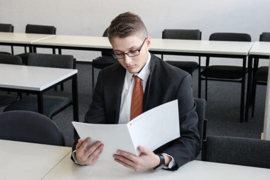 young man reviewing living trust and will